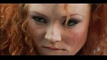 In stockings and a garter belt, Audrey Anal, a redhead, is wearing