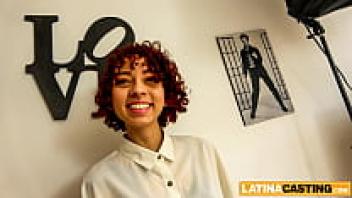 A Latina with a curly red hair was released from her first anal casting cumshot.