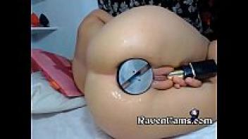 Extremely large butt plug pushed into a tight, soft ass by a horny camgirl