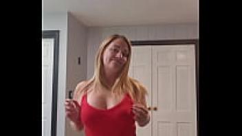 To music, the wife strips.