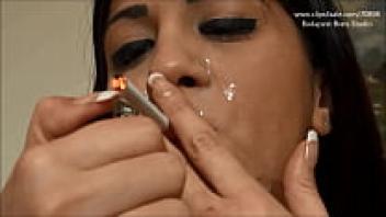 Girl Smokes While Mouthing Cum