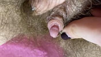 Intense Closeup Wet, hairy pussy rubbing the big clit during an orgasm