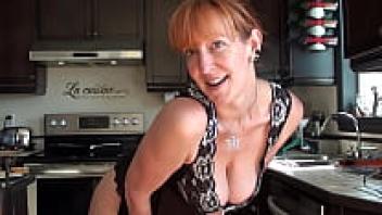 Cute redhead milf taunting us while cooking