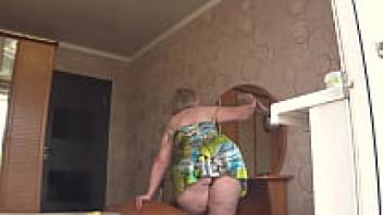 Through the open window, the neighbour observes the plump milf. PAWG.