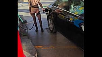 At a gas station, flashing